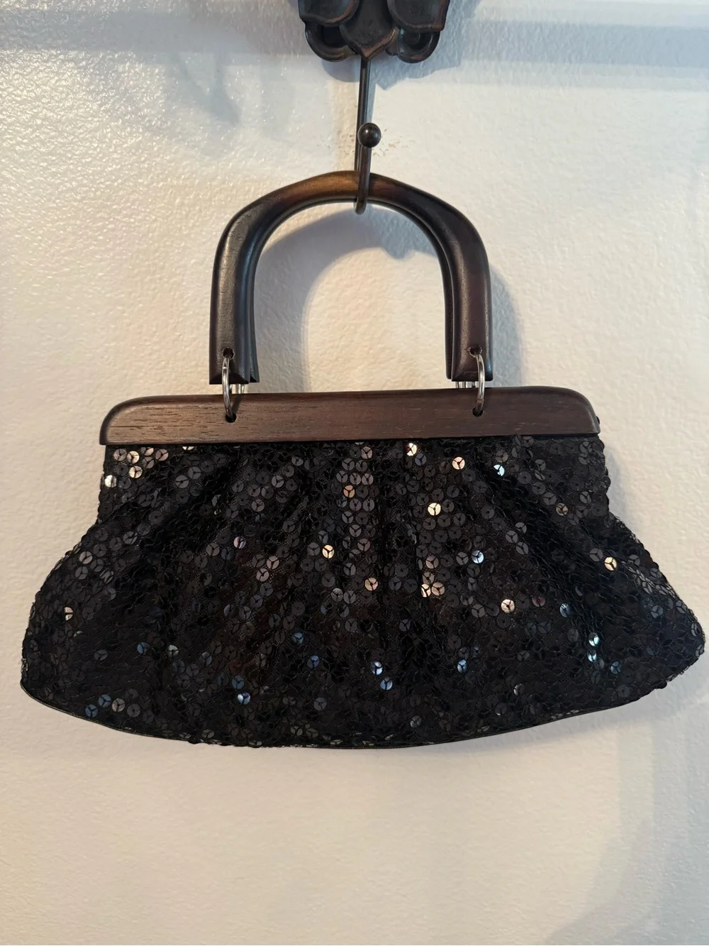 Vintage black sequin handbag with wood trim and handles.